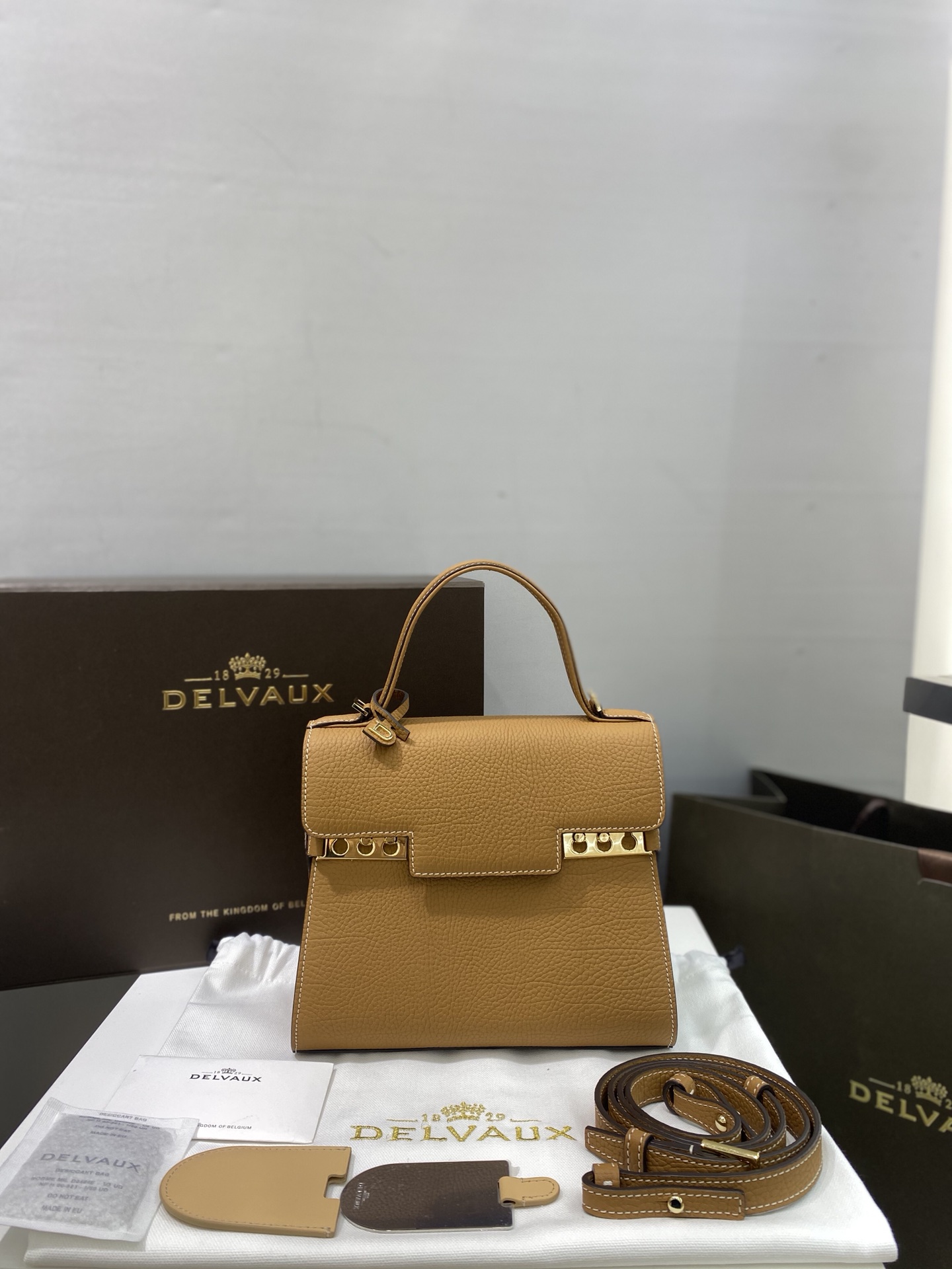Delvaux Tempete PM is available in a new size and in caramel with cow neck pattern Tempete was designed in 1967 by the famous Belgian architect Paule Goethals for Delvaux's 1967 "Yachting" series Size: 21.5cm wide, 19cm high, 10cm deep.