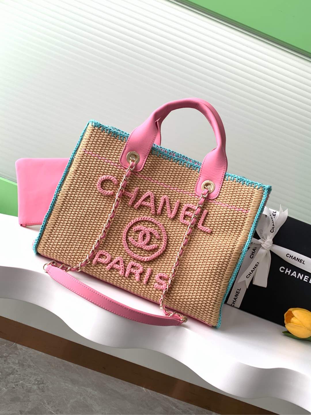 CHANEL Woven CHANEL beach bag | romantic summer atmosphere The unique woven material and fresh color combination create a summer atmosphere