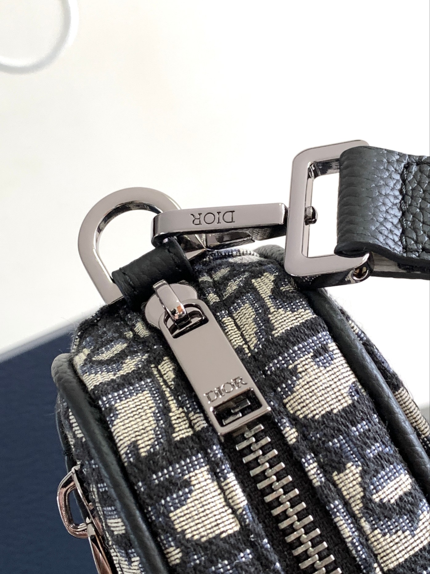 Dior Safari Messenger Bag Features & Materials: Main material: Beige and black Oblique print fabric Details: Black-grained calfskin leather accents Dimensions: 17 × 12.5 × 4 cm (L × H × W) Model number: 2ESWS011YKY_H27E 7 Dior Safari Messenger Bag Features & Materials: Main material: Beige and black Oblique print fabric Details: Black-grained calfskin leather accents Dimensions: 17 × 12.5 × 4 cm (L × H × W) Model number: 2ESWS011YKY_H27E - Image 7