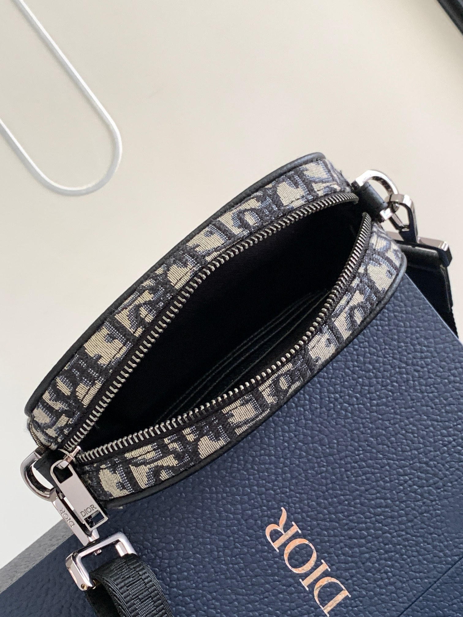 Dior Safari Messenger Bag Features & Materials: Main material: Beige and black Oblique print fabric Details: Black-grained calfskin leather accents Dimensions: 17 × 12.5 × 4 cm (L × H × W) Model number: 2ESWS011YKY_H27E 8 Dior Safari Messenger Bag Features & Materials: Main material: Beige and black Oblique print fabric Details: Black-grained calfskin leather accents Dimensions: 17 × 12.5 × 4 cm (L × H × W) Model number: 2ESWS011YKY_H27E - Image 8