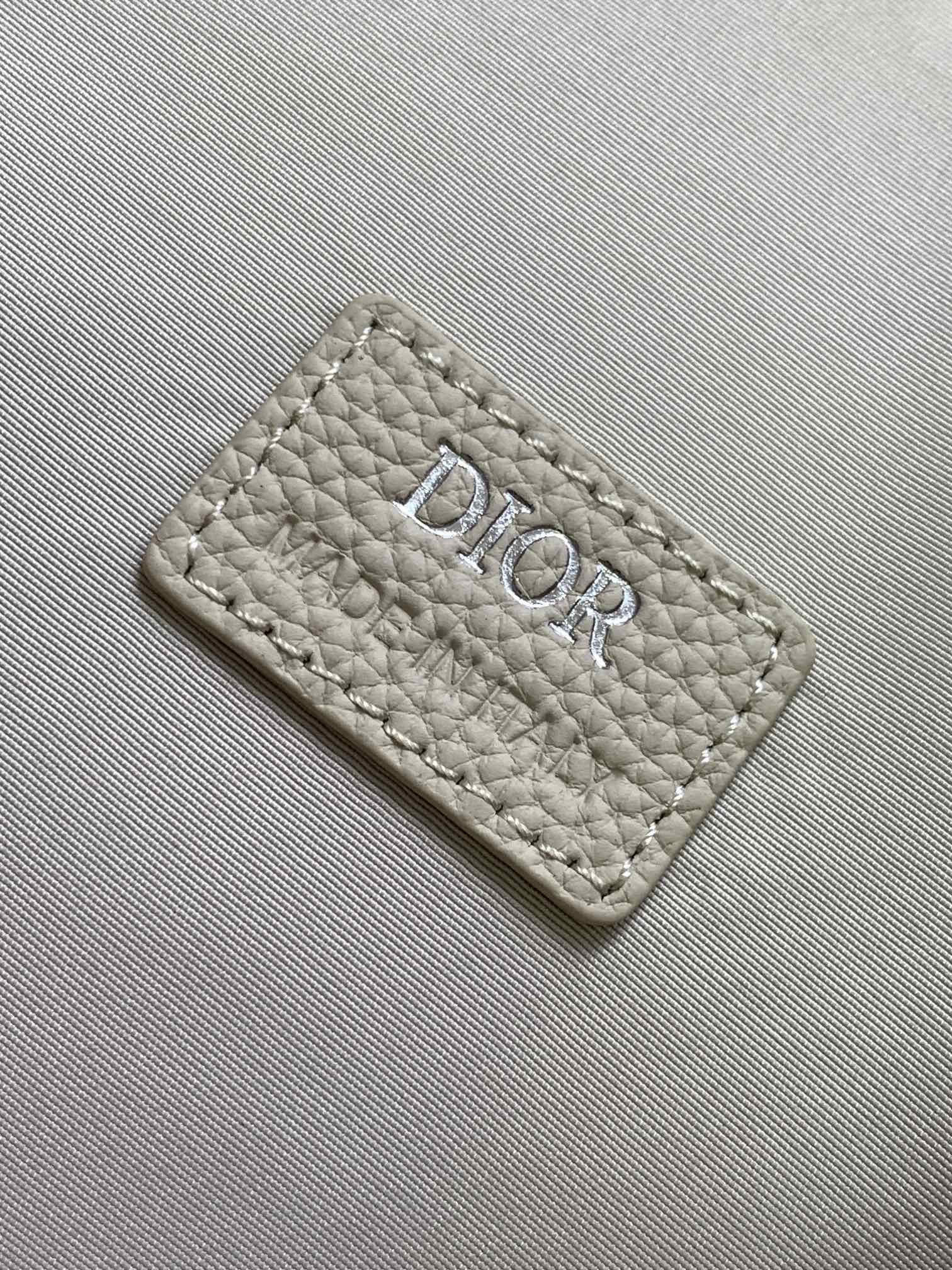 Dior Briefcase Main materials: Cotton, calfskin leather, and technical fabric Interior lining: Technical fabric, cotton, calfskin leather Dimensions: Size: 37 x 28 x 6 cm (L x H x W) Model number: 1ESBR180YKY_H03E 9 Dior Briefcase Main materials: Cotton, calfskin leather, and technical fabric Interior lining: Technical fabric, cotton, calfskin leather Dimensions: Size: 37 x 28 x 6 cm (L x H x W) Model number: 1ESBR180YKY_H03E - Image 9