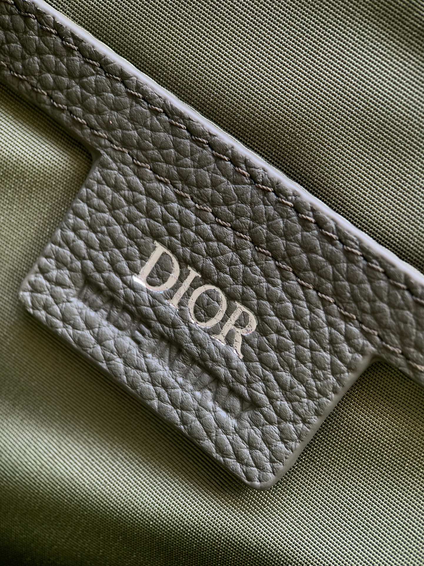 Dior Hit The Road collection Main material: Cotton, tech fabric, calfskin Lining: Tech fabric, cotton, calfskin Size: 24 x 18 x 8 cm Model number: EBA-1ESPO333YKY_H27E 9 Dior Hit The Road collection Main material: Cotton, tech fabric, calfskin Lining: Tech fabric, cotton, calfskin Size: 24 x 18 x 8 cm Model number: EBA-1ESPO333YKY_H27E - Image 9