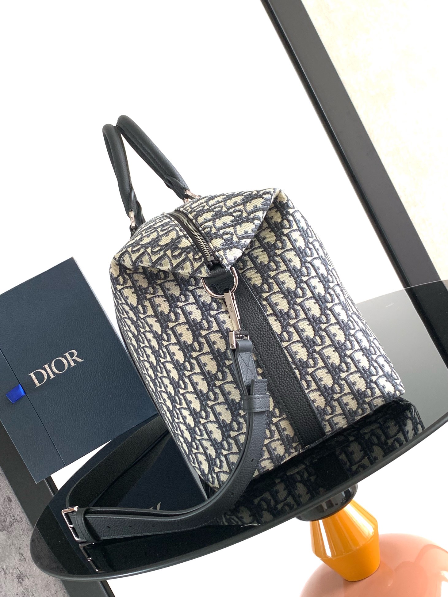 Dior Weekender 40 Handbag Key Features: Main materials: Cotton, calfskin leather, and technical fabric Interior lining: Technical fabric, cotton, and calfskin leather Dimensions: Size: 57.5 x 34.5 x 22 cm (L x H x W) Model number: 1ESDU134YKY_H03E 3 Dior Weekender 40 Handbag Key Features: Main materials: Cotton, calfskin leather, and technical fabric Interior lining: Technical fabric, cotton, and calfskin leather Dimensions: Size: 57.5 x 34.5 x 22 cm (L x H x W) Model number: 1ESDU134YKY_H03E - Image 3