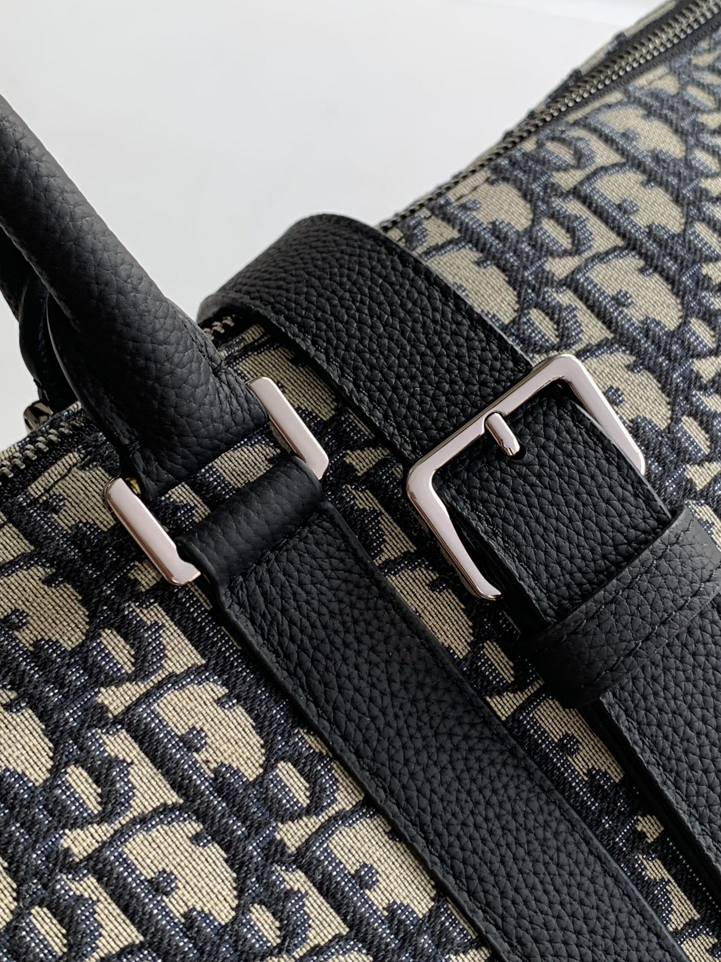 Dior Weekender 40 Handbag Key Features: Main materials: Cotton, calfskin leather, and technical fabric Interior lining: Technical fabric, cotton, and calfskin leather Dimensions: Size: 57.5 x 34.5 x 22 cm (L x H x W) Model number: 1ESDU134YKY_H03E 8 Dior Weekender 40 Handbag Key Features: Main materials: Cotton, calfskin leather, and technical fabric Interior lining: Technical fabric, cotton, and calfskin leather Dimensions: Size: 57.5 x 34.5 x 22 cm (L x H x W) Model number: 1ESDU134YKY_H03E - Image 8