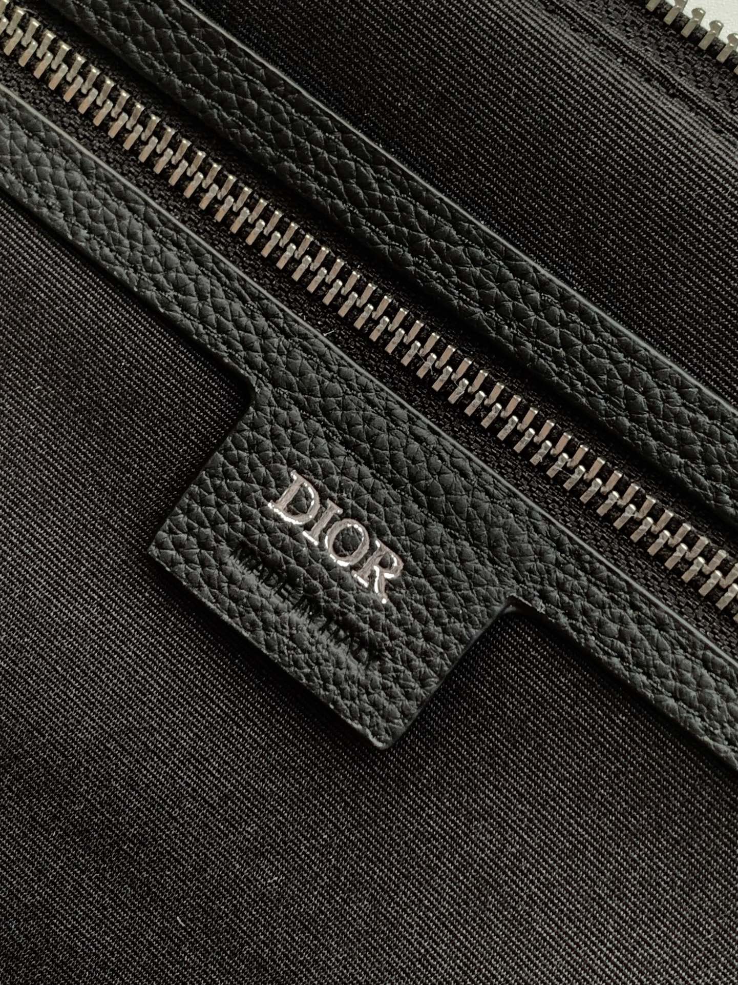Dior Weekender 40 Handbag Key Features: Main materials: Cotton, calfskin leather, and technical fabric Interior lining: Technical fabric, cotton, and calfskin leather Dimensions: Size: 57.5 x 34.5 x 22 cm (L x H x W) Model number: 1ESDU134YKY_H03E 9 Dior Weekender 40 Handbag Key Features: Main materials: Cotton, calfskin leather, and technical fabric Interior lining: Technical fabric, cotton, and calfskin leather Dimensions: Size: 57.5 x 34.5 x 22 cm (L x H x W) Model number: 1ESDU134YKY_H03E - Image 9
