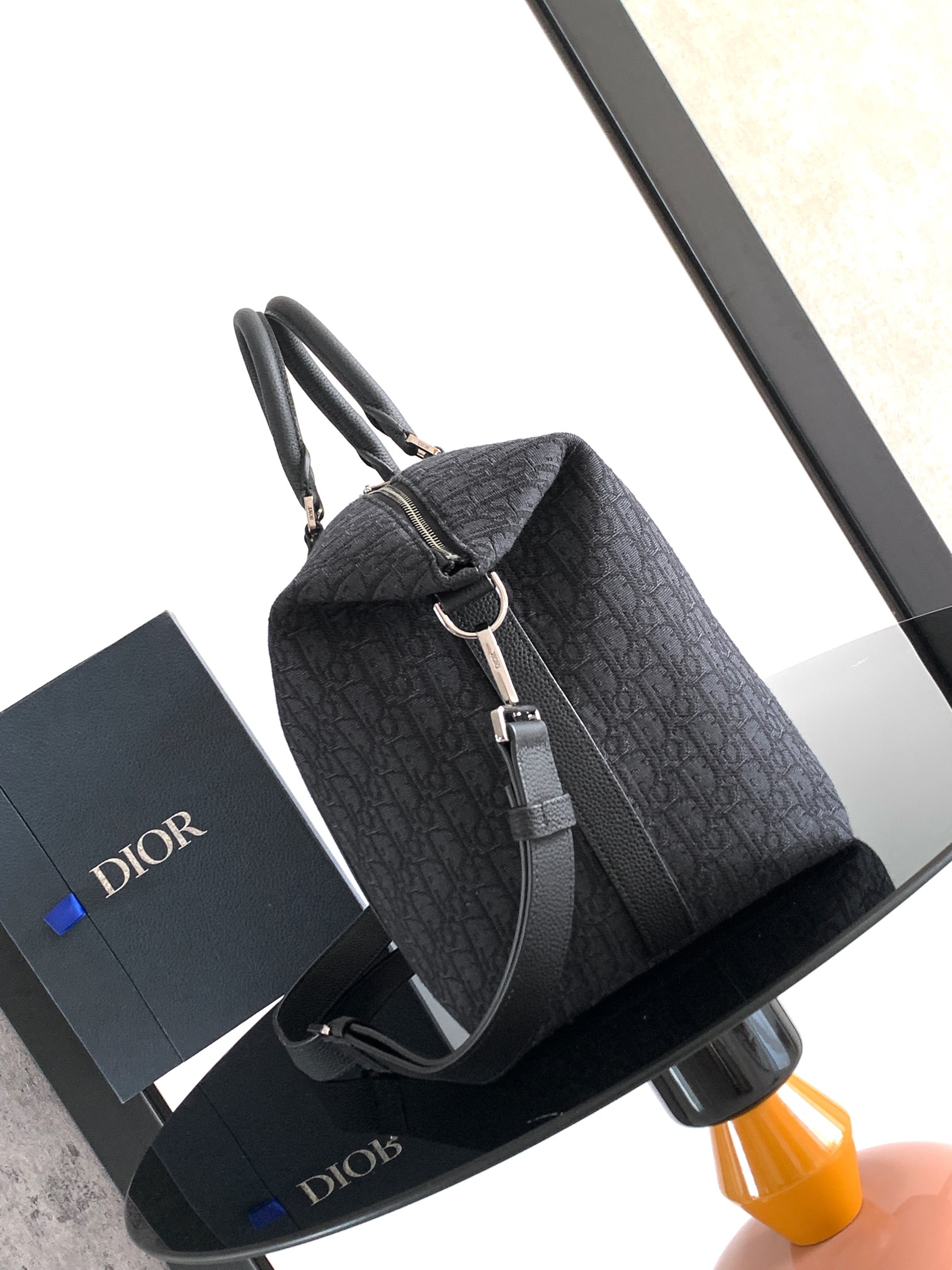 Dior Weekender 40 Handbag Key Features: Main materials: Cotton, calfskin leather, and technical fabric Interior lining: Technical fabric, cotton, and calfskin leather Dimensions: Size: 57.5 x 34.5 x 22 cm (L x H x W) Model number: 1ESDU134YKY_H03E 3 Dior Weekender 40 Handbag Key Features: Main materials: Cotton, calfskin leather, and technical fabric Interior lining: Technical fabric, cotton, and calfskin leather Dimensions: Size: 57.5 x 34.5 x 22 cm (L x H x W) Model number: 1ESDU134YKY_H03E - Image 3